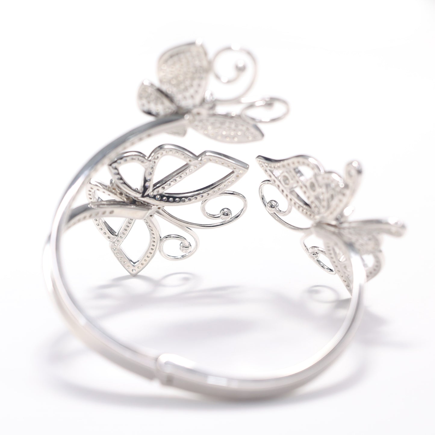 Micro-setting butterflies Lab created stones rise and dance bangle, sterling silver.