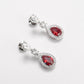 Boucles d'oreilles pendantes en forme de goutte d'eau avec pierres créées par le laboratoire couleur rubis micro-serti, argent sterling