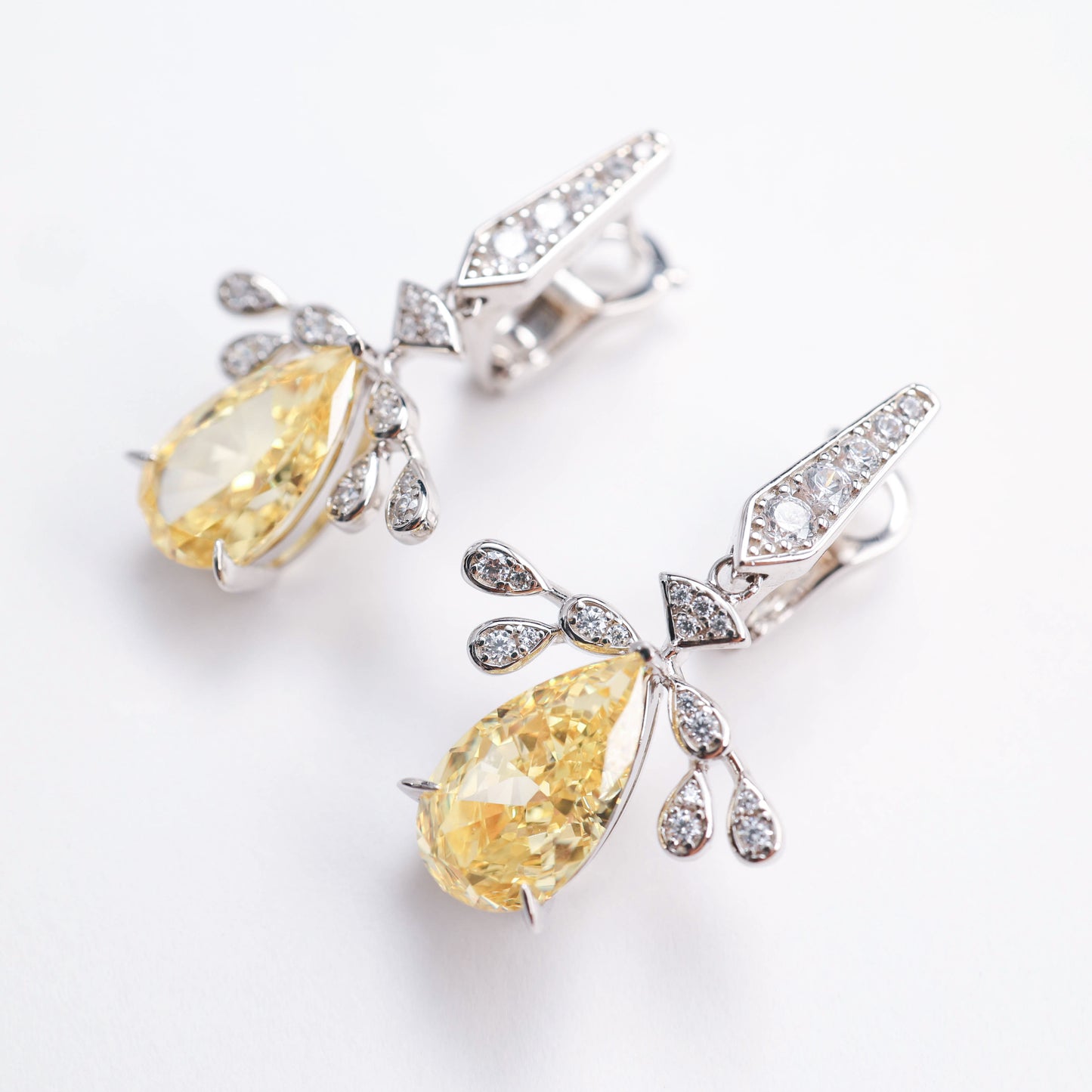 Micro-setting Yellow diamond color Lab created stones Angel's Wings earrings. sterling silver.