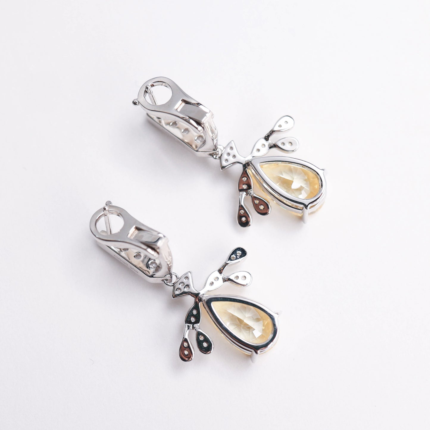 Micro-setting Yellow diamond color Lab created stones Angel's Wings earrings. sterling silver.